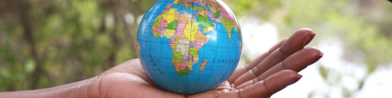 Hands holding a globe