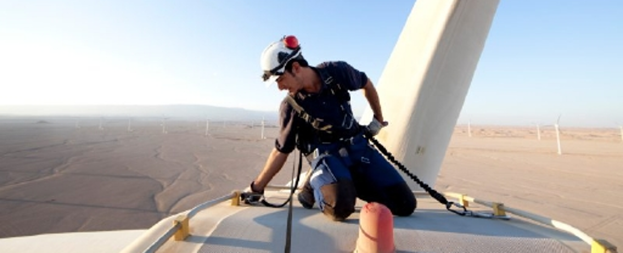 Egyptian engineer checks wind turbine
