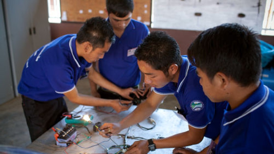 4 students work on cables