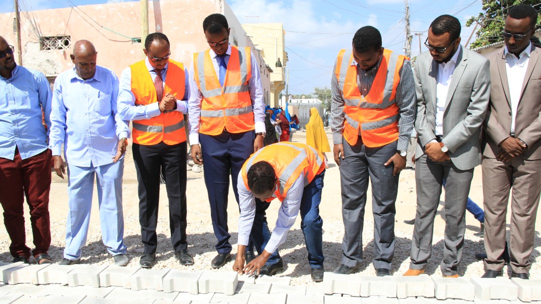 In Mogadischu the first model stones are put into place for a road building programme.