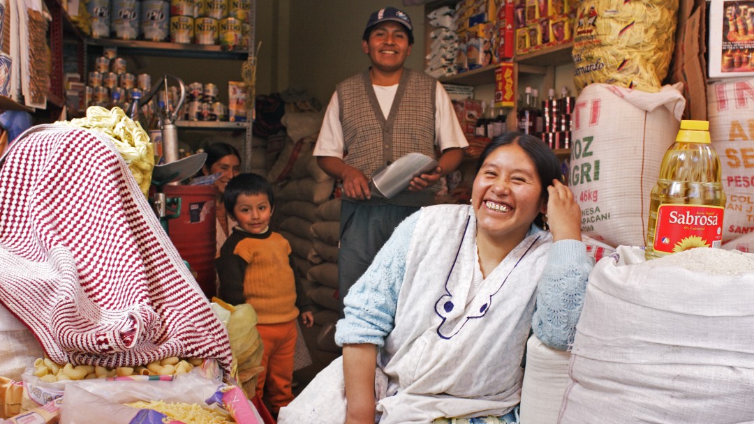 A family in front of their shop