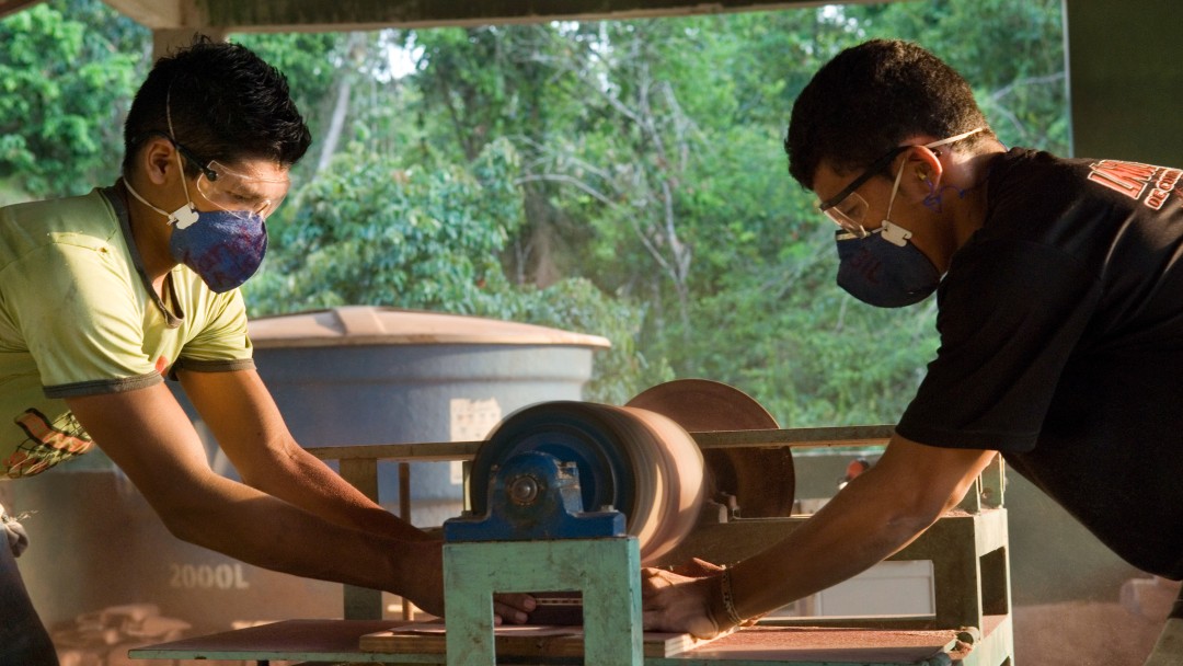 Two young men making handicrafts