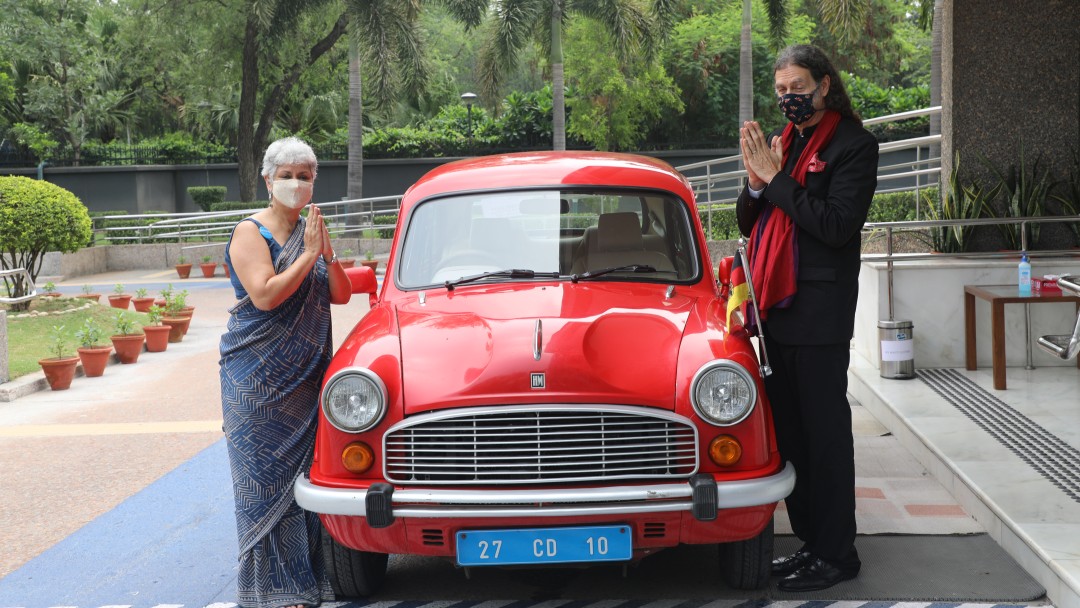 The German ambassadors arrive in the red ambassador car