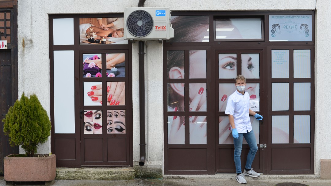 Nikola Lukač in front of his store