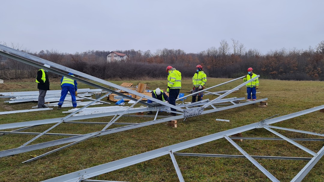 Workers building new electricity pylons. 