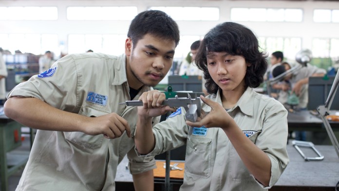 A boy and a girl in handicraft