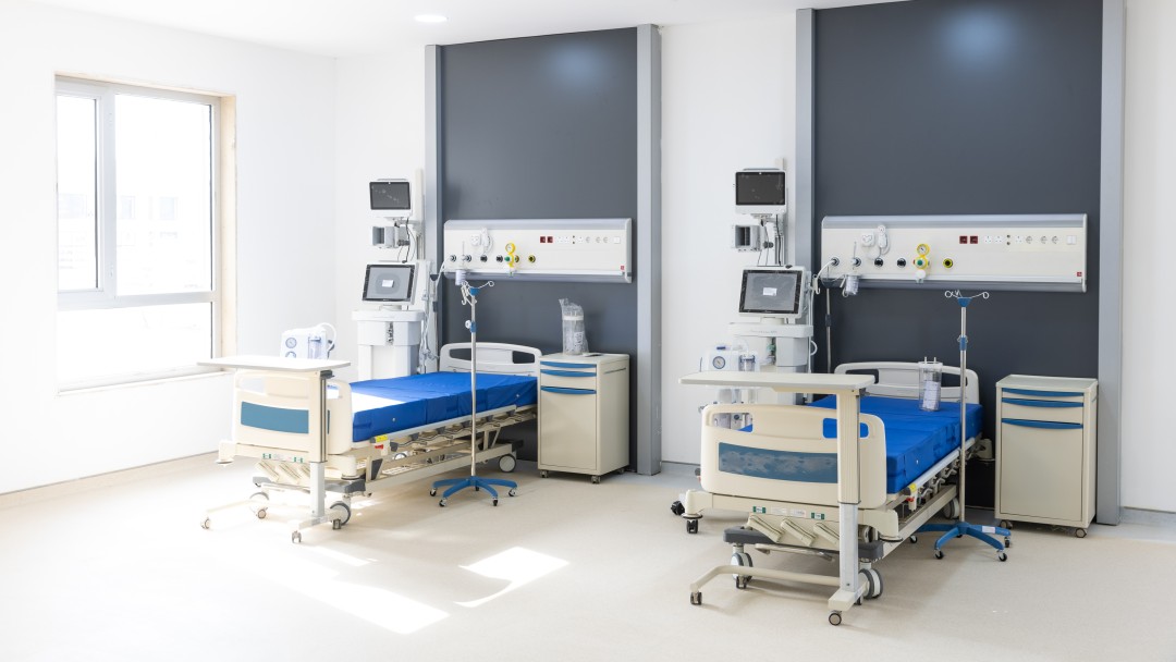 A patient room with comprehensive equipment for monitoring patients.