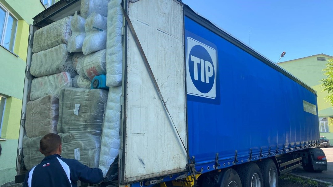 Blue truck loaded with packed material