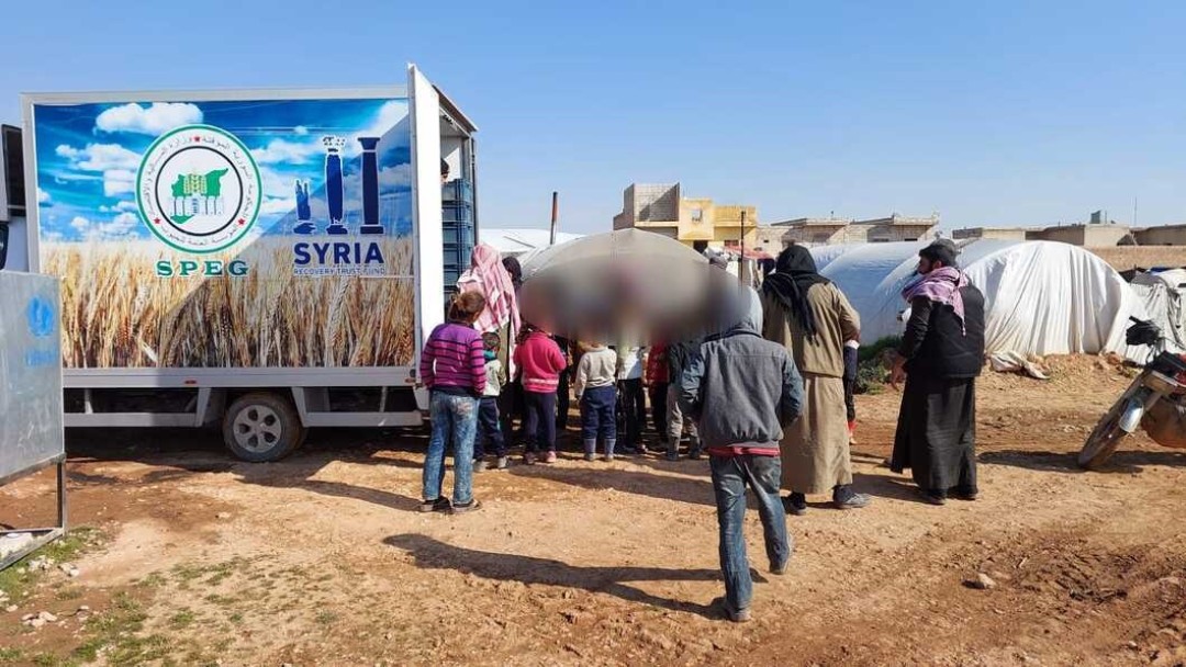 Verteilung von Brotpaketen in Syrien
