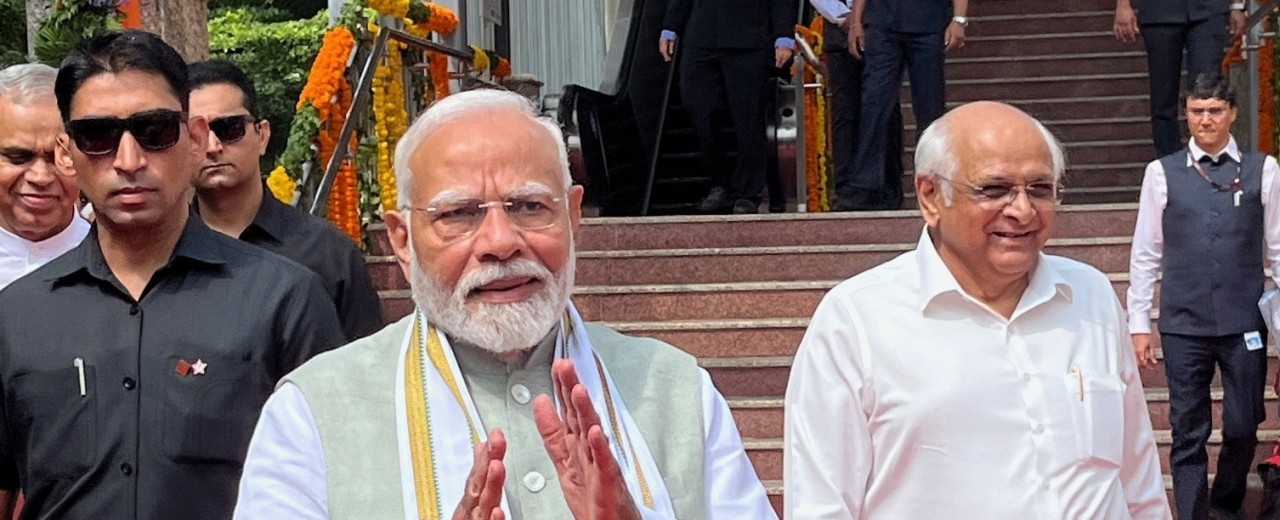 Indian Prime Minister Modi in front of a railway station