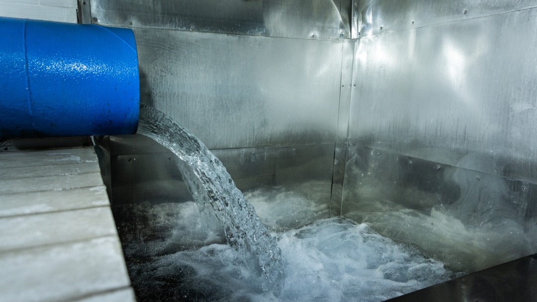 Water flows from a pipe into the main water reservoir.