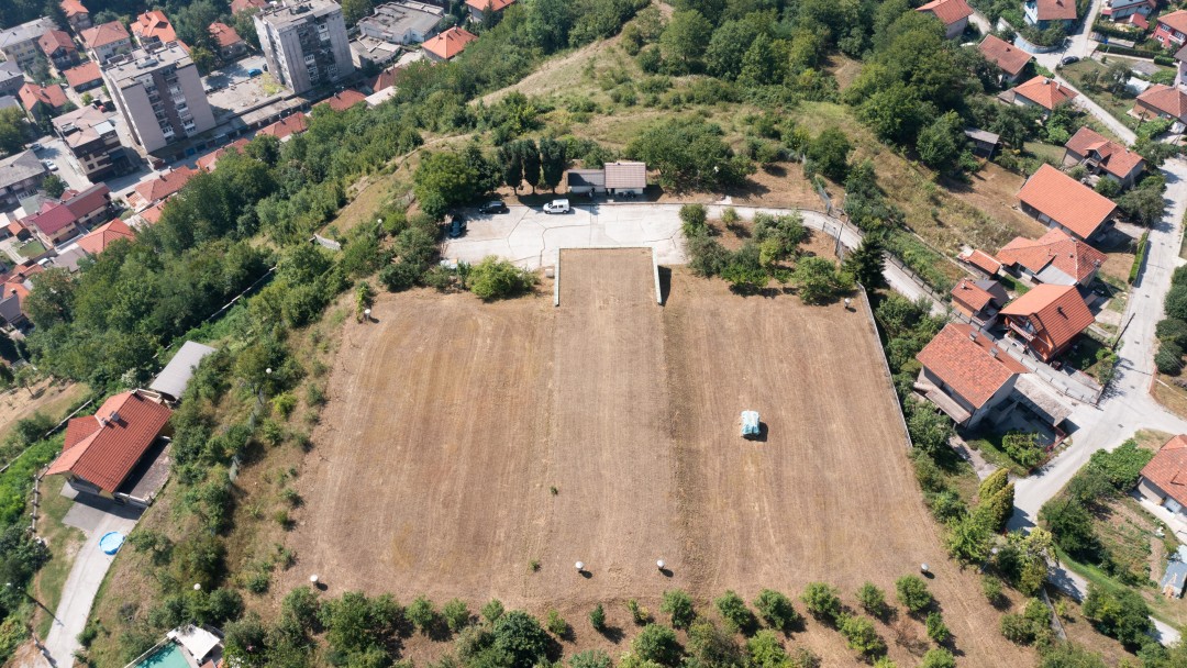 Aerial view of a field in the city, under which the main water reservoir of Zenica is located