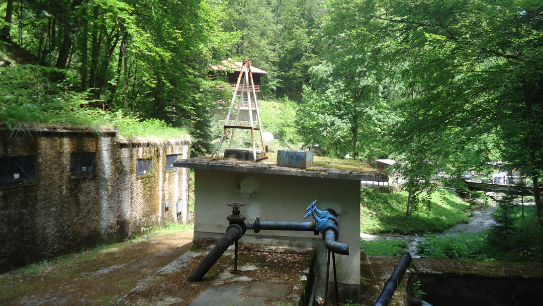 Water system with pipes and stream in the forest