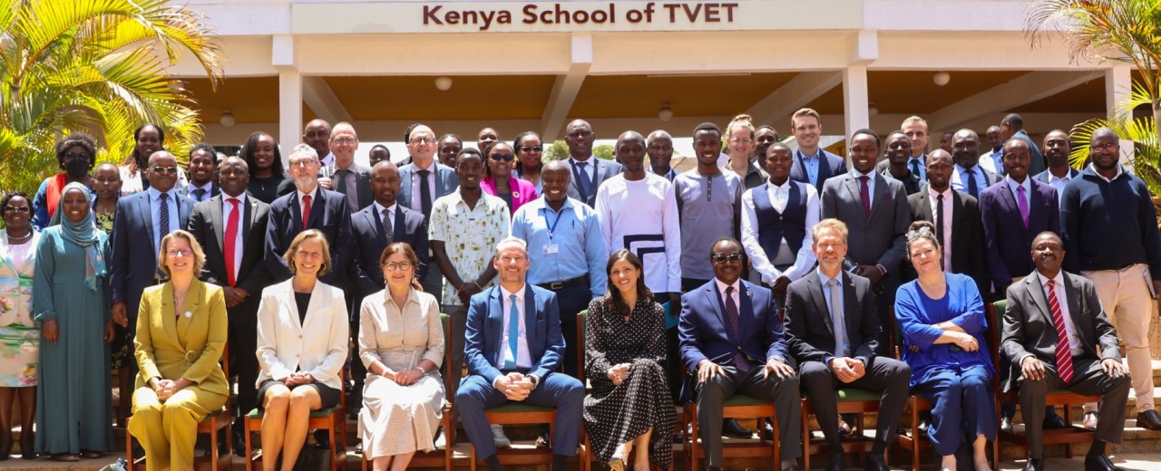 Group photo of the development partners together with young apprentices and representatives from the Kenyan education sector in front of the Kenya School of TVET 