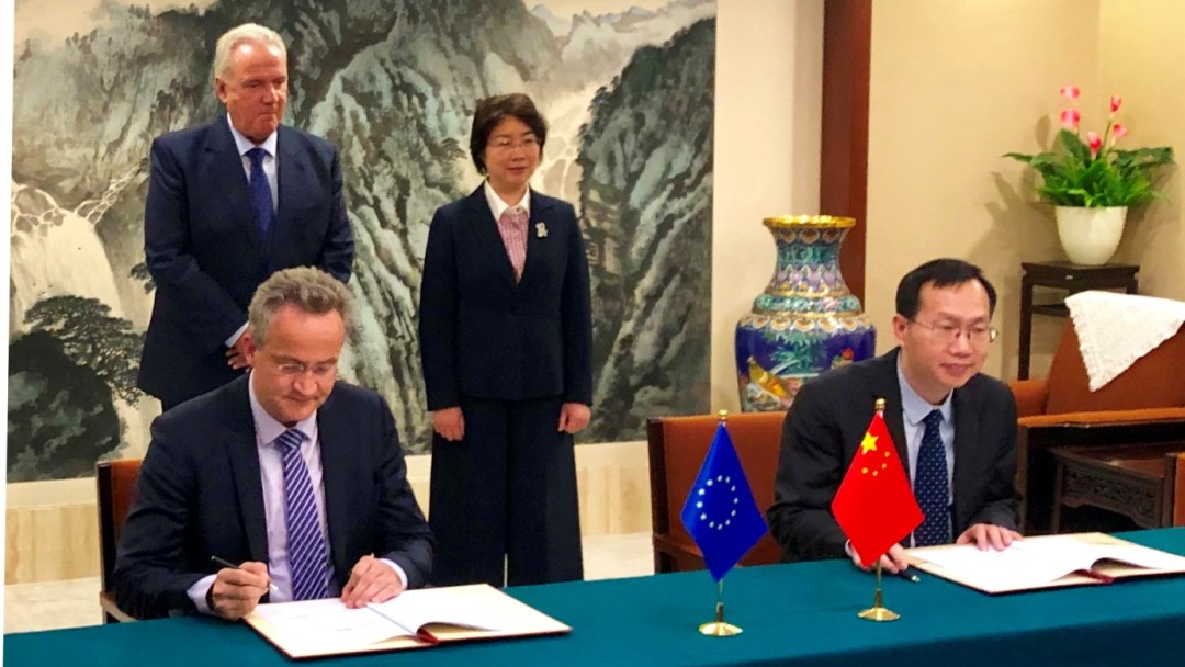 Signing the agreement in Beijing. 