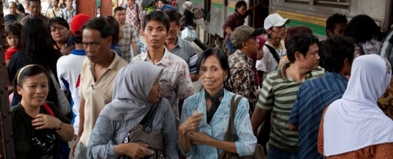 Central station in a large city, passengers boarding a train