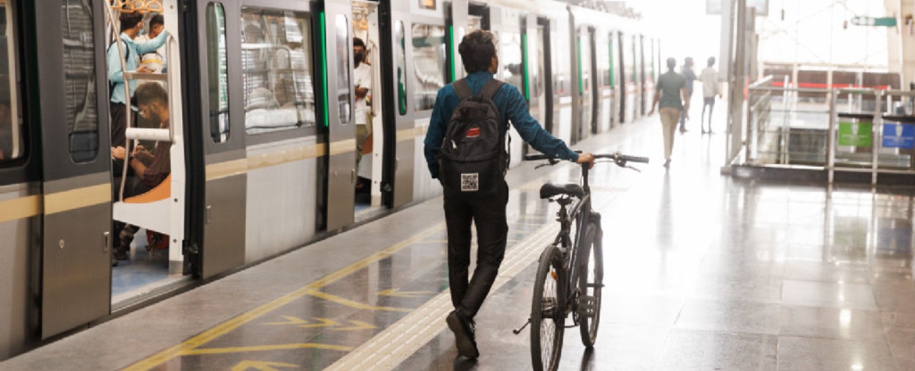 Man with bike in a metro station