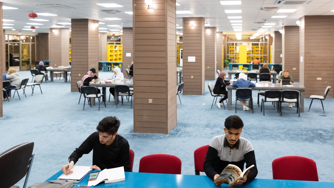 Students sitting in the central library at the University of Mosul