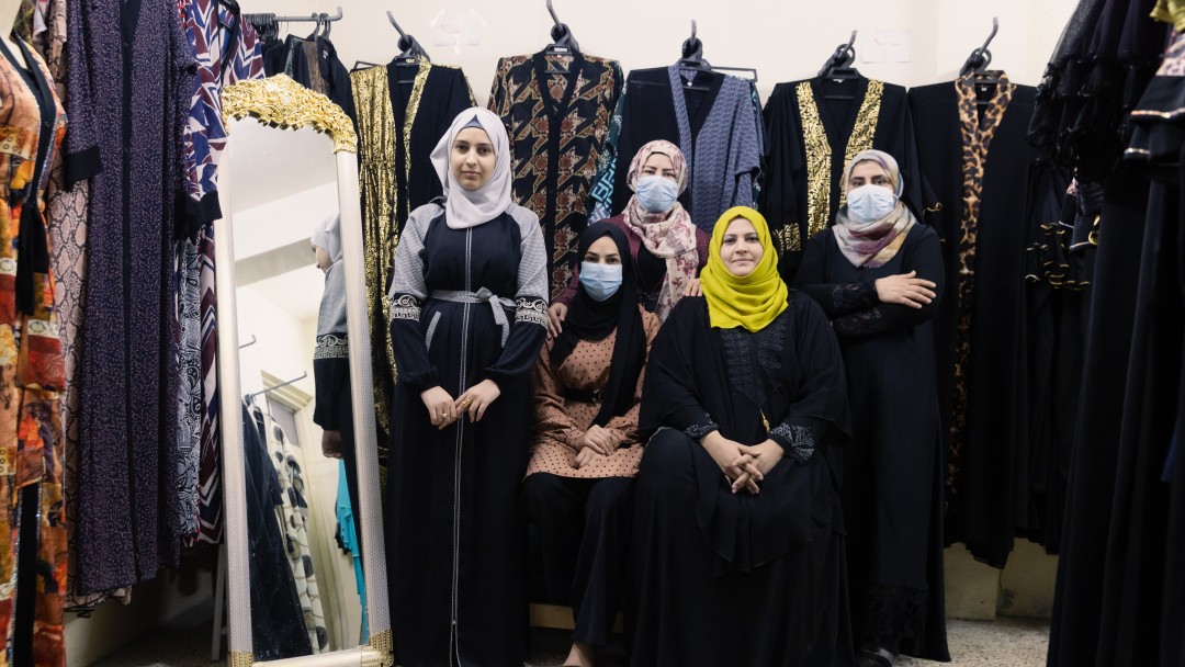 Several women in a clothing store