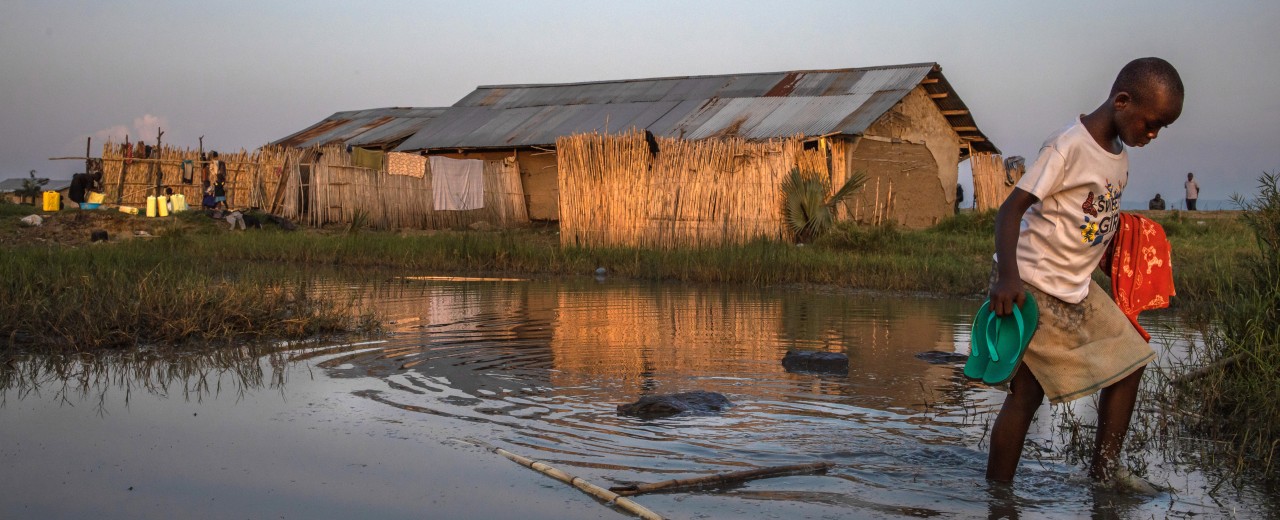 Child wading through a moat