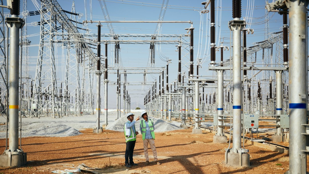 Dileswar Sahoo, Asst. General Manager TATA (links), on the area of a 400 KV switchgear substation in Hindupur