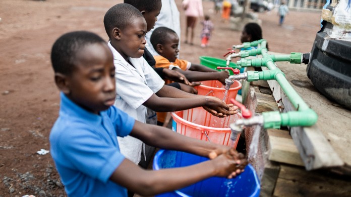 Children washing their hands 