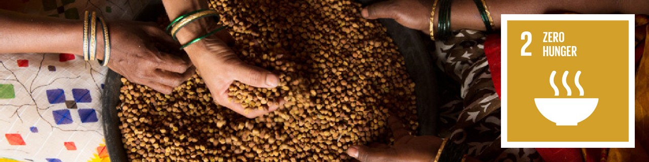 Three hands process grains in a bowl 