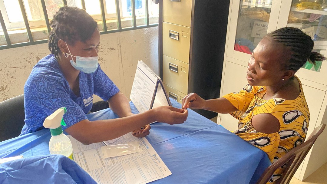 A woman visits a doctor for a counselling session.