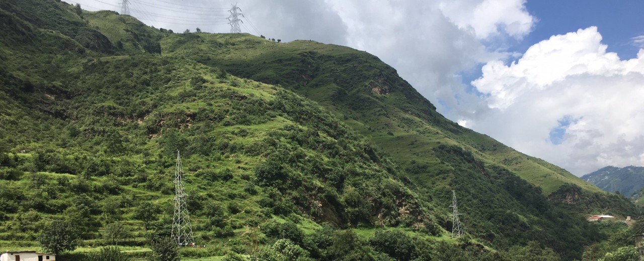 Mountains, river and electricity pylons in India