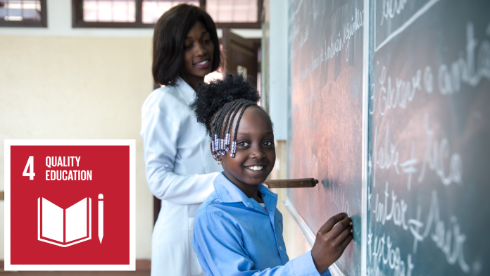 A girl is smiling and writes something on the blackboard, next to it is the icon of SDG 4: quality education