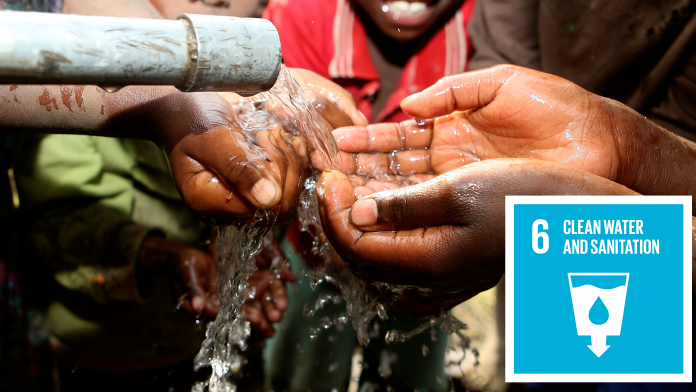 Hands being washed, next to it: the Icon of SDG 6: clean water and sanitation 