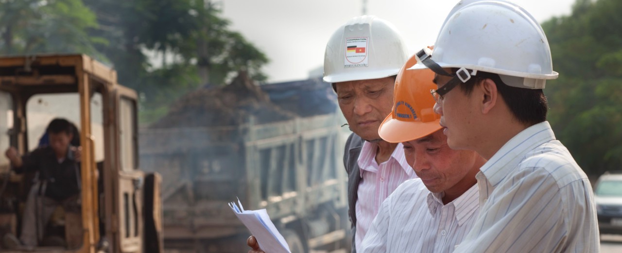 Men discussing a plan.