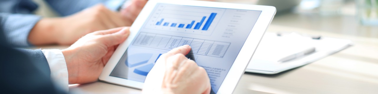 Cropped shot of a group of businesspeople looking at graphs on digital tablets