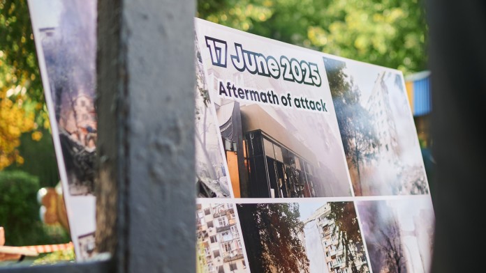  Photos behind a fence show the destruction, including of the kindergarten #334