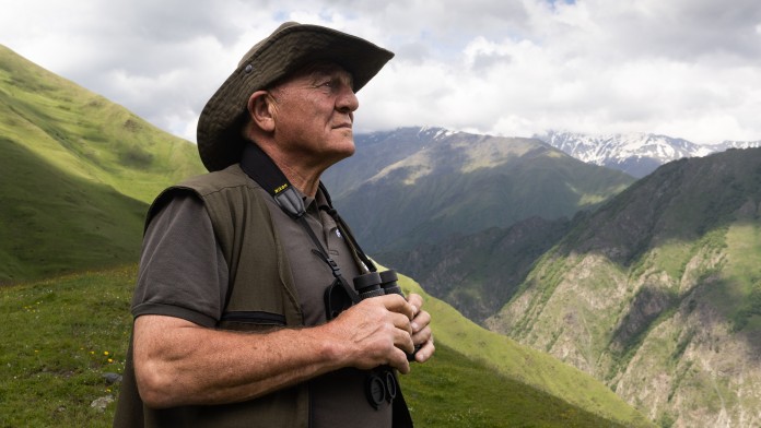 Ranger observes animals and nature in Pshav-Khevsureti National Park, Georgia